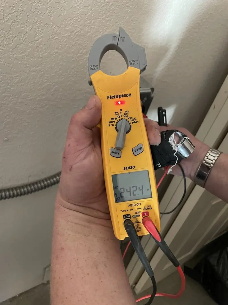 Voltage testing with clamp meter during Outlet Installation in Wheat Ridge